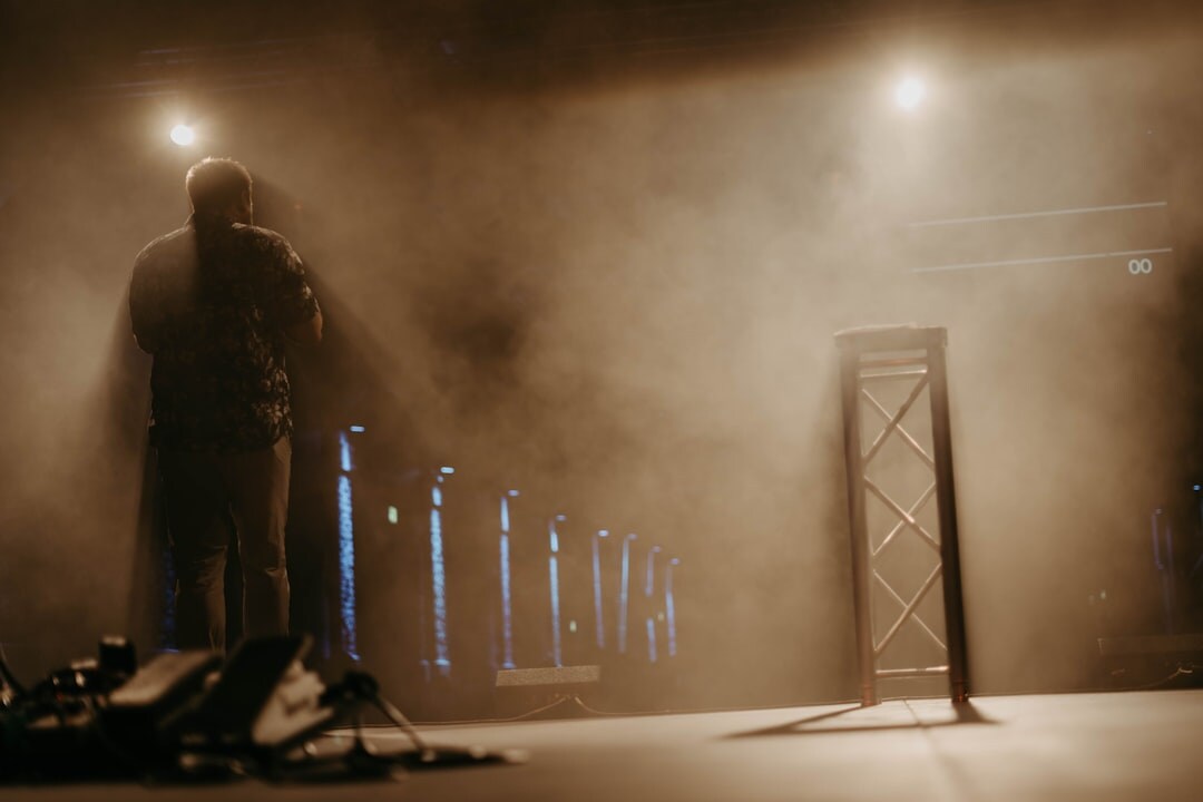 Empty stage with spotlights ready for a speaker